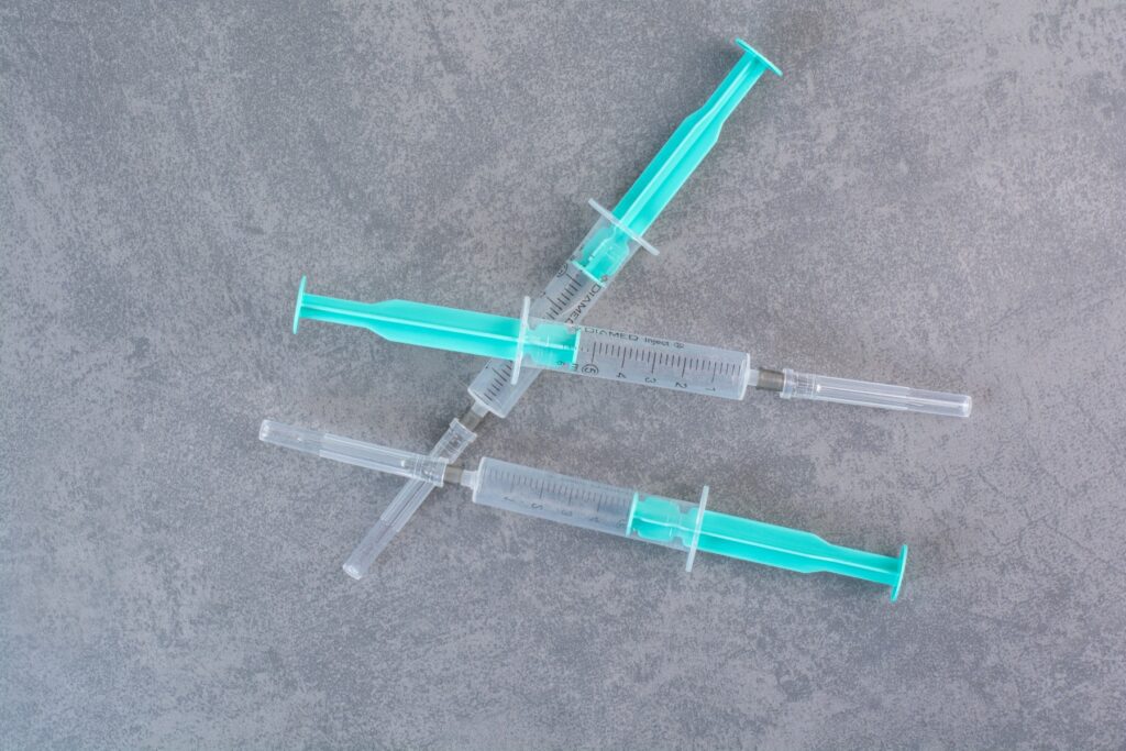 three-syringes-with-serum-marble-surface (1)